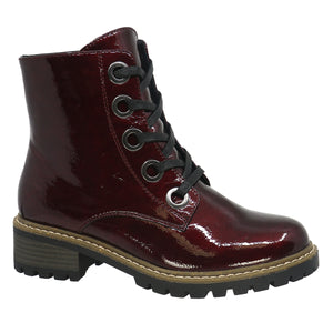 Burgundy patent leather ankle boot with black laces and a lug sole.