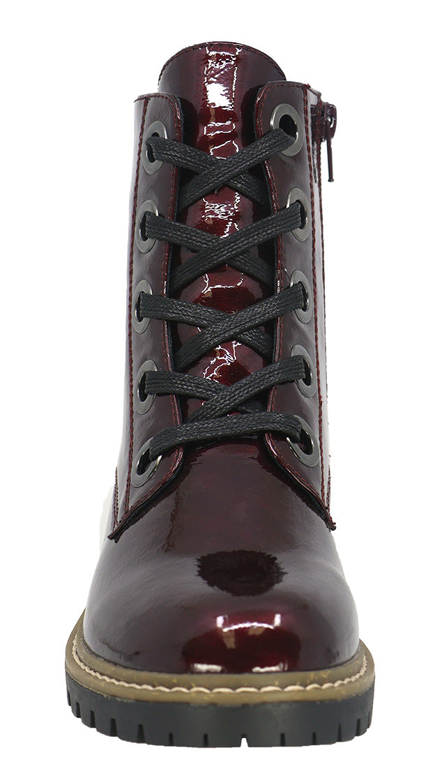 Front view of a shiny dark red boot with black laces.