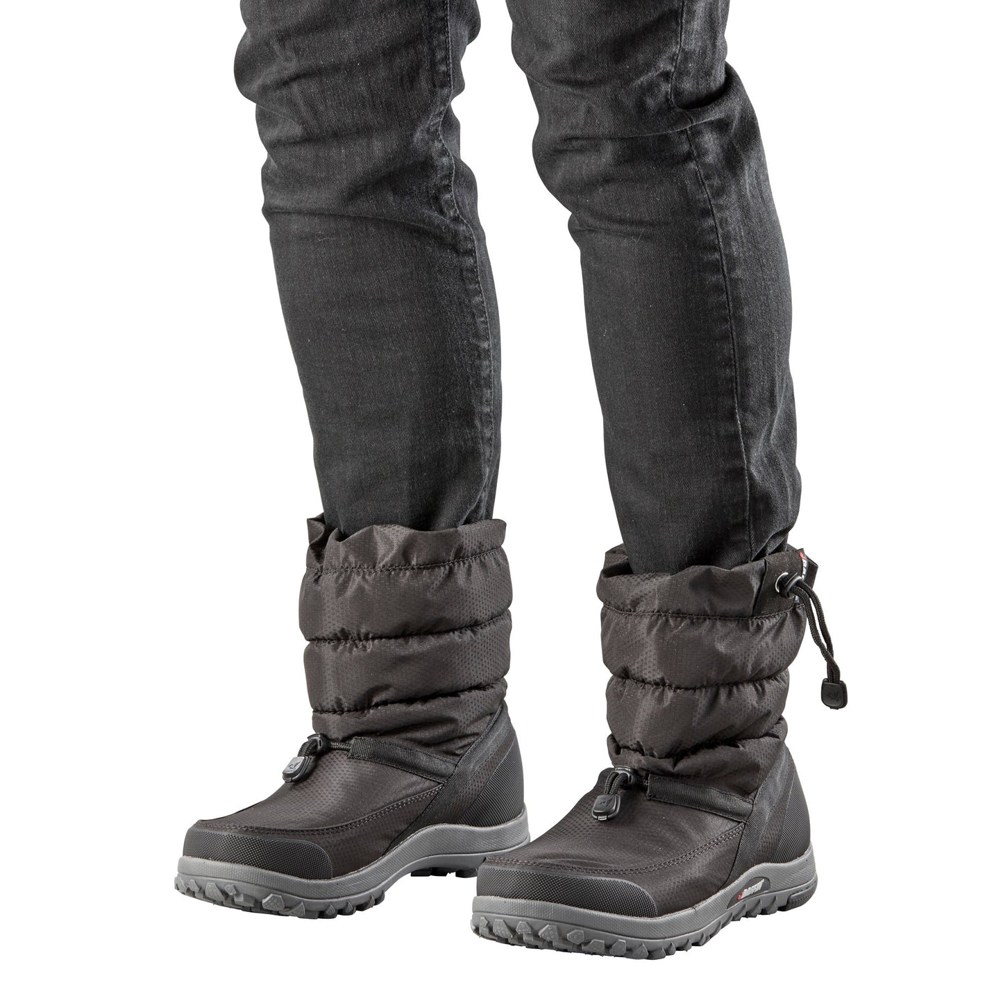 Two gray puffer boots with drawstring closure being worn with black jeans.
