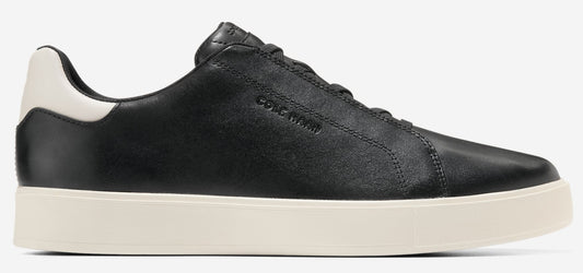 Black leather sneaker with white sole and heel.