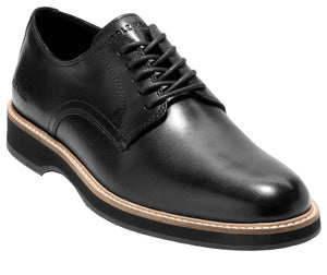 Black leather dress shoe with black laces and a thick, layered sole.
