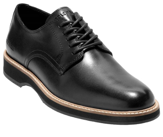 Black leather dress shoe with black laces and a thick, layered sole.