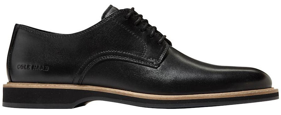 A black leather dress shoe with laces and a stacked heel.