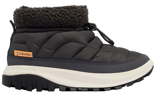 A black ankle boot with a quilted nylon upper, a dark brown faux-shearling collar, a bungee cord lace system with a toggle, and a thick, white, contoured midsole sitting atop a rugged, black, lugged rubber outsole, featuring an orange logo tag on the side.
