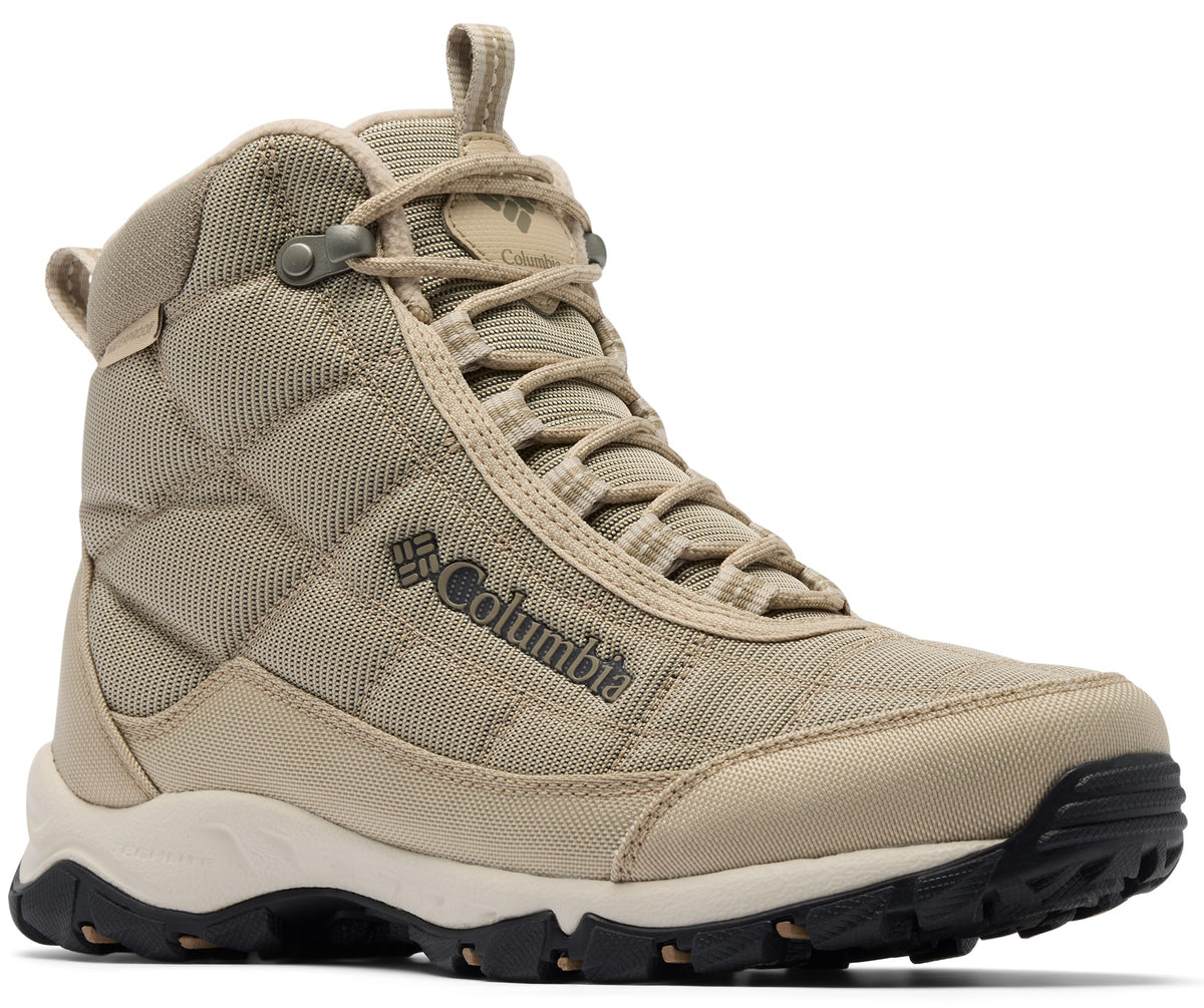 A tan Columbia high-top hiking boot with quilted fabric panels, a lace-up closure, and a rugged black rubber sole.
