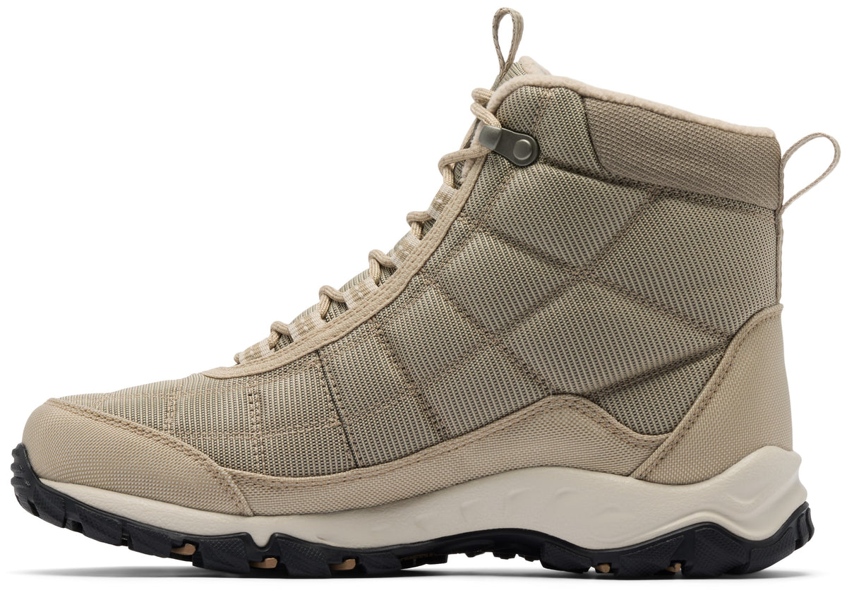 A tan-colored, high-top ankle boot with a textured nylon upper, lace-up front, cream-colored midsole, and rugged black rubber outsole.