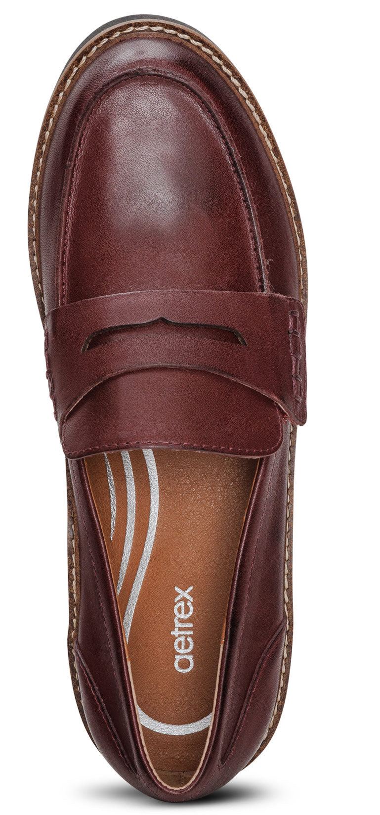 Top-down view of a shiny burgundy leather penny loafer.