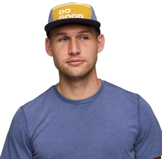 Person wearing a T-shirt and baseball hat with the words "DO GOOD" on the front.
