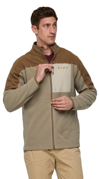 Tan and brown fleece jacket with full zipper and chest pocket, worn by a man.