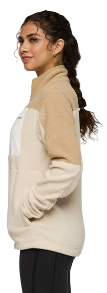 A woman wearing a color-blocked fleece jacket with a high collar and a quarter zip.