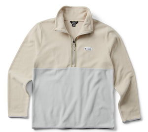 A long-sleeved two-tone fleece pullover with a partial zipper and a logo tag on the chest.
