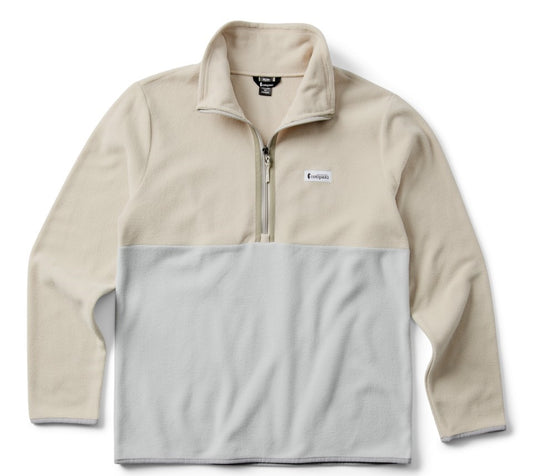A long-sleeved two-tone fleece pullover with a partial zipper and a logo tag on the chest.