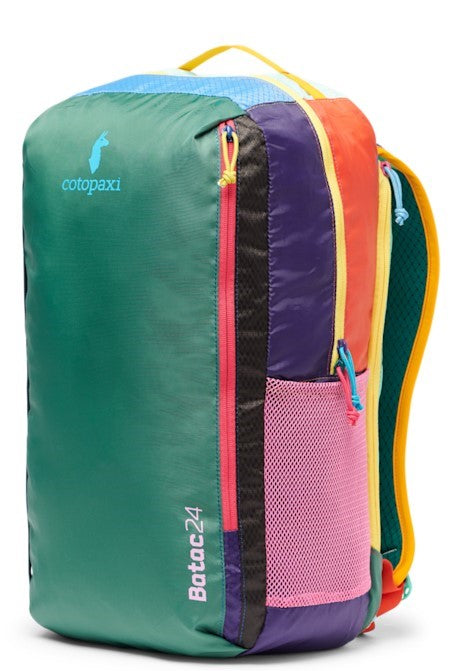 Multi-colored backpack with a green front, purple, pink mesh pocket, orange, and yellow side panel. Batac 24 is written on the front.