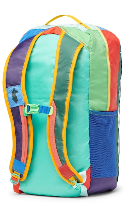 Back view of a colorful backpack with purple, blue, green, red, and yellow hues.