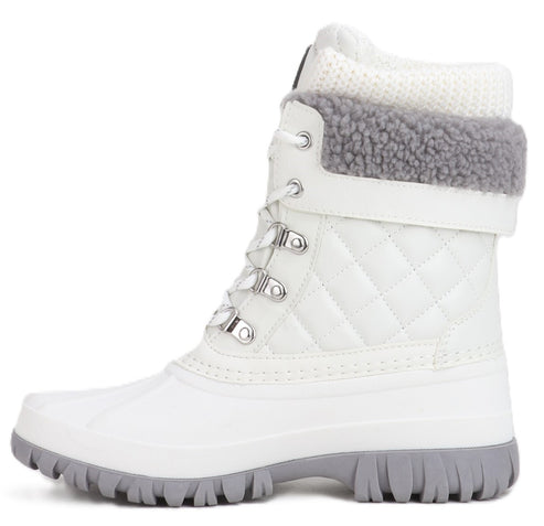 White mid-calf height quilted duck boot with gray trim.