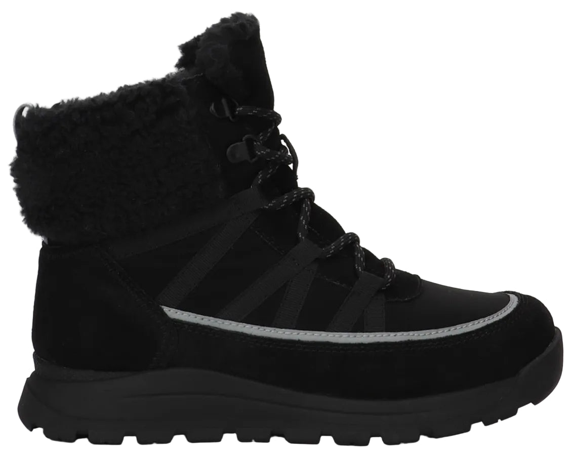 A black ankle-height winter boot featuring a fuzzy faux fur cuff, a lace-up front with dark patterned laces, and a thin reflective silver strip along the side above a thick, rugged black sole.