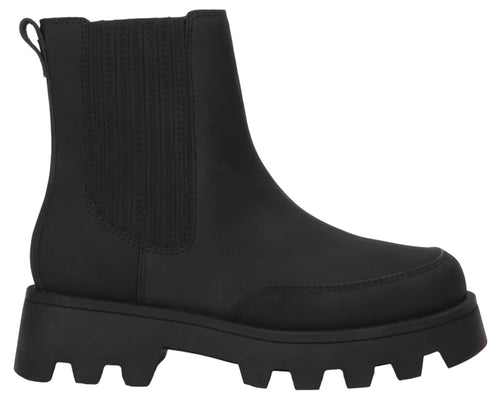 A black ankle-length Chelsea boot featuring a thick, chunky rubber lug sole, a pull tab at the back, and ribbed elastic side panels.