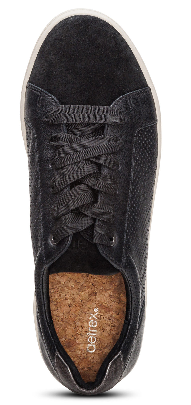 A close-up of a black casual shoe with a cork insole.