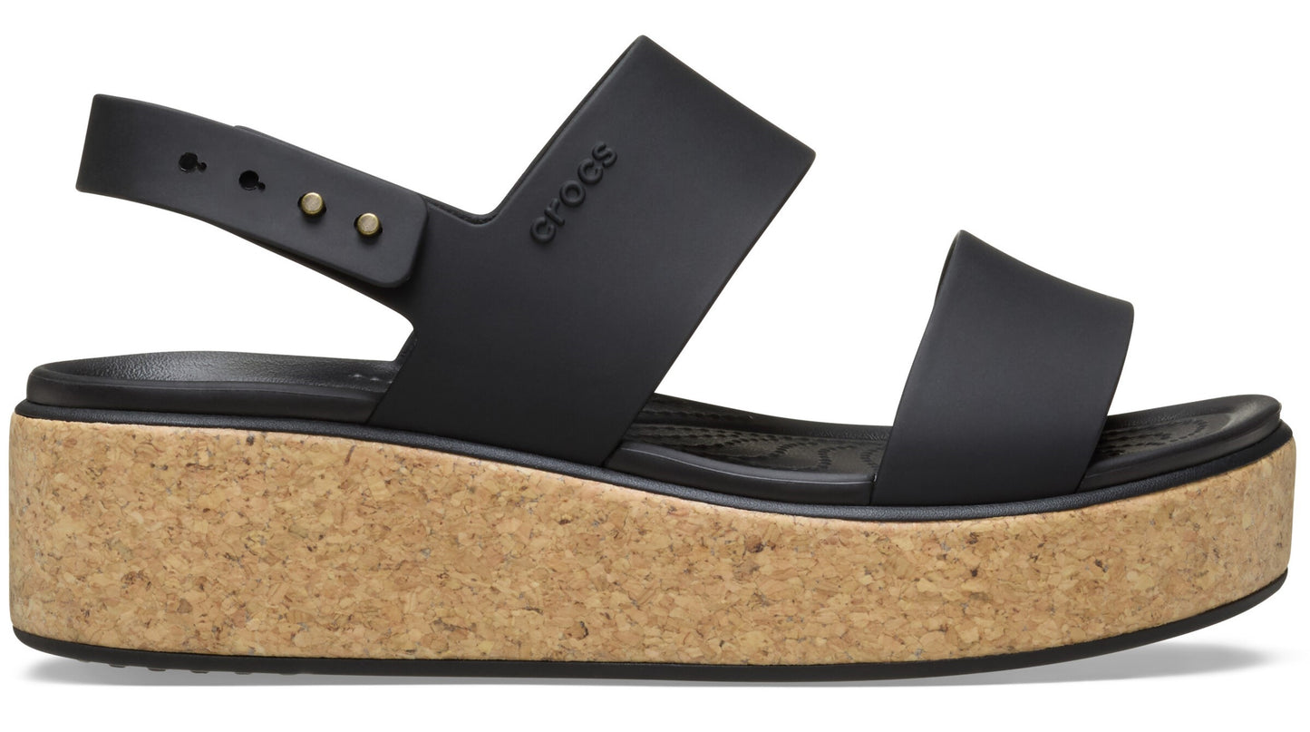 Black platform sandal with cork wedge and two horizontal straps and a buckled heel strap.