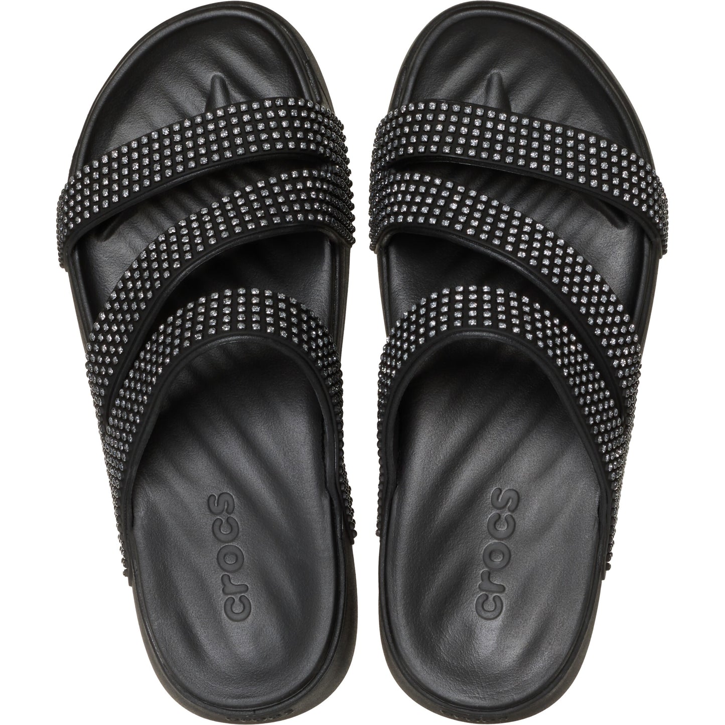 Top-down view of black sandals with three studded straps.