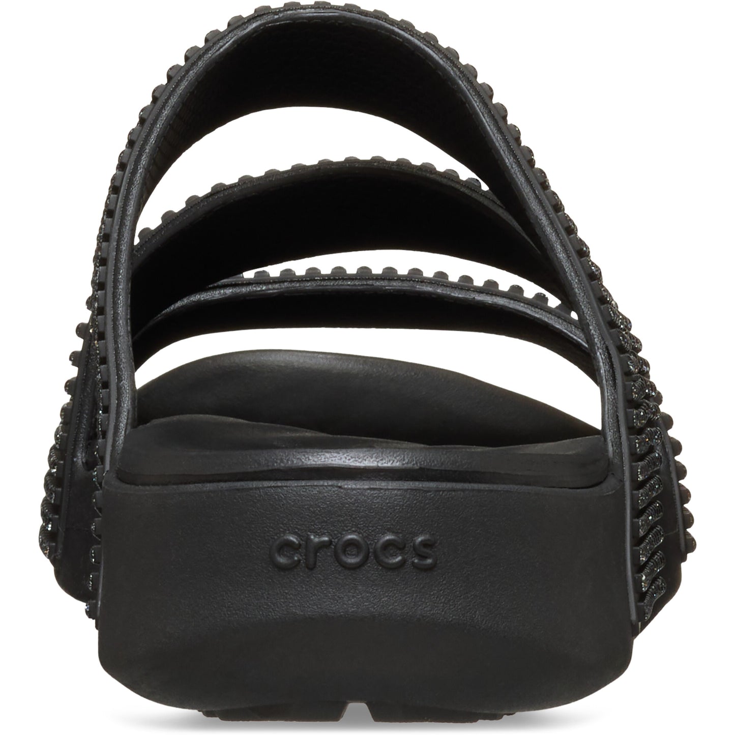 Black sandal with three studded straps and the word "crocs" on the heel.