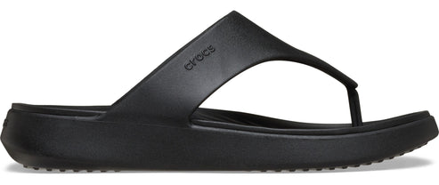 A black flip-flop with the brand name Crocs on the side.
