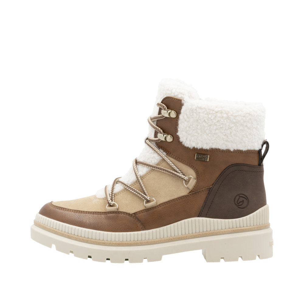 Brown and beige waterproof winter boot with faux shearling cuff and lug sole.
