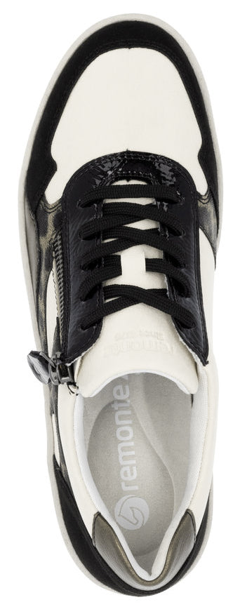 A black and white sneaker with black laces and a side zipper.