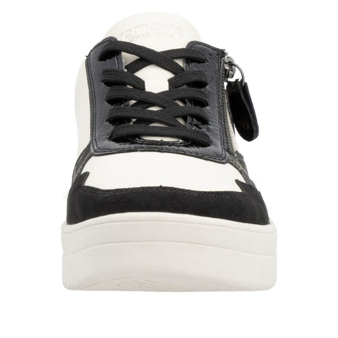 Black and white platform shoe with black laces.