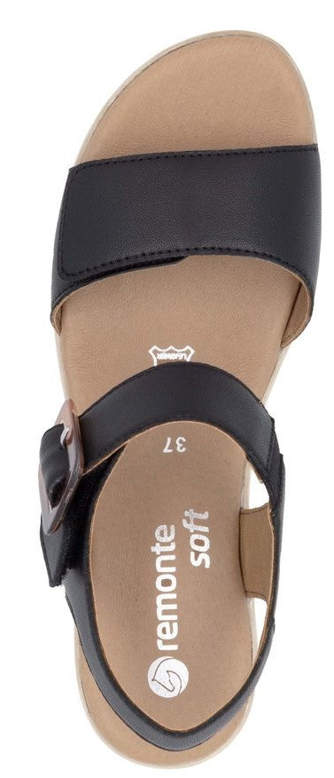 Black sandal with a buckle strap and a thick sole.