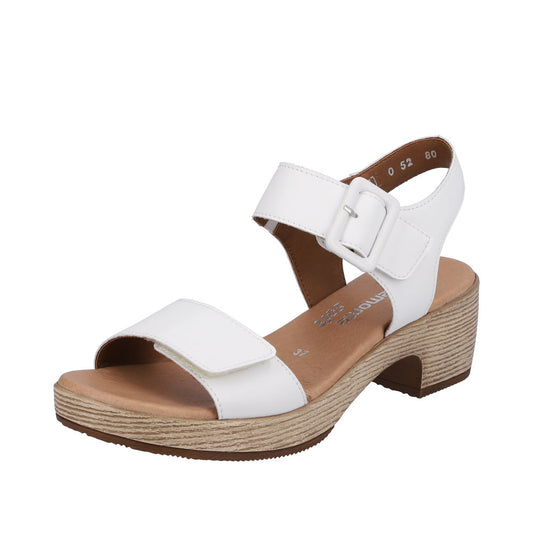 White platform sandals with block heels and adjustable ankle straps.
