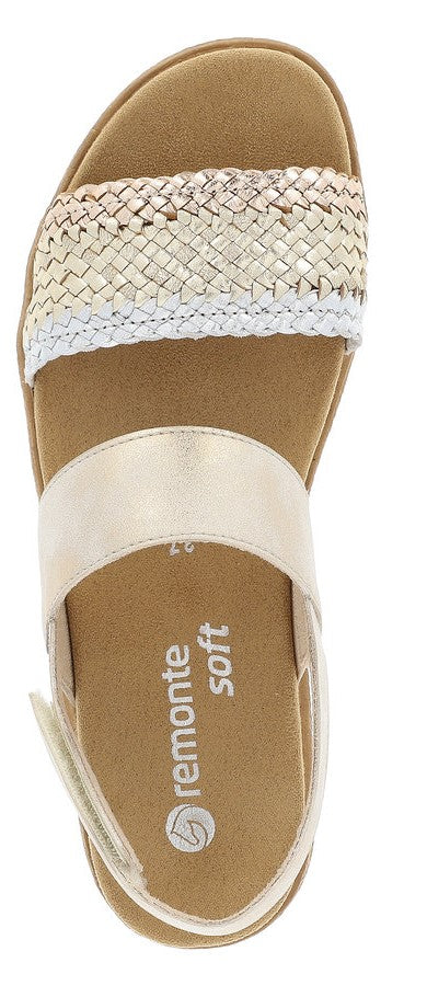 A golden sandal with a woven strap and 'remonte soft' printed on the insole.