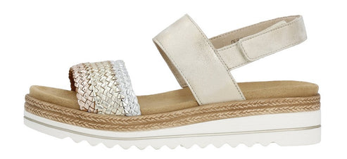 A side-view of an off-white platform sandal with woven metallic strap.