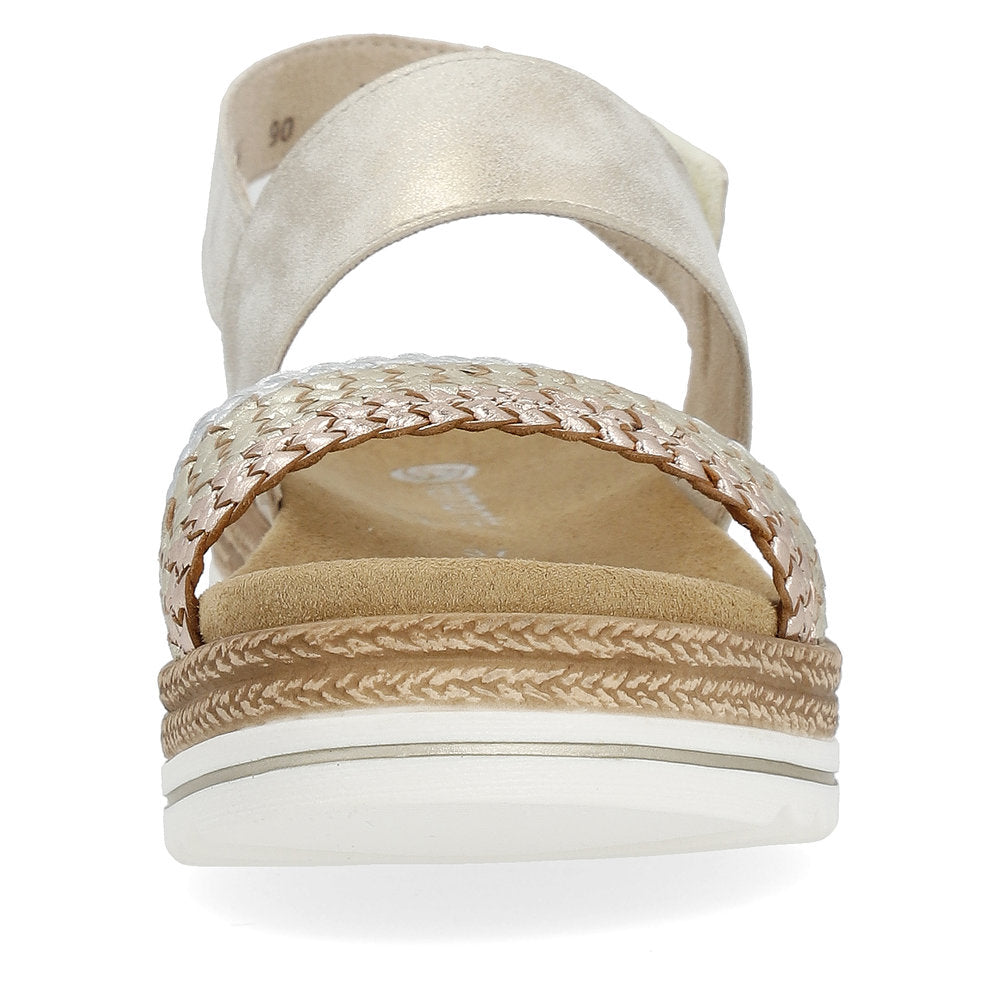 Front view of women's gold colored sandals with a woven upper and platform sole.