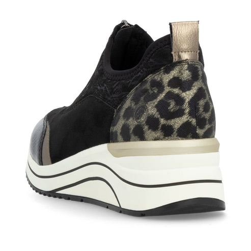 Angled view of a black slip-on shoe with animal print heel, white platform sole, and metallic accent.