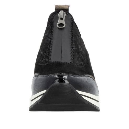 Front view of a black sneaker with a zipper on the heel.