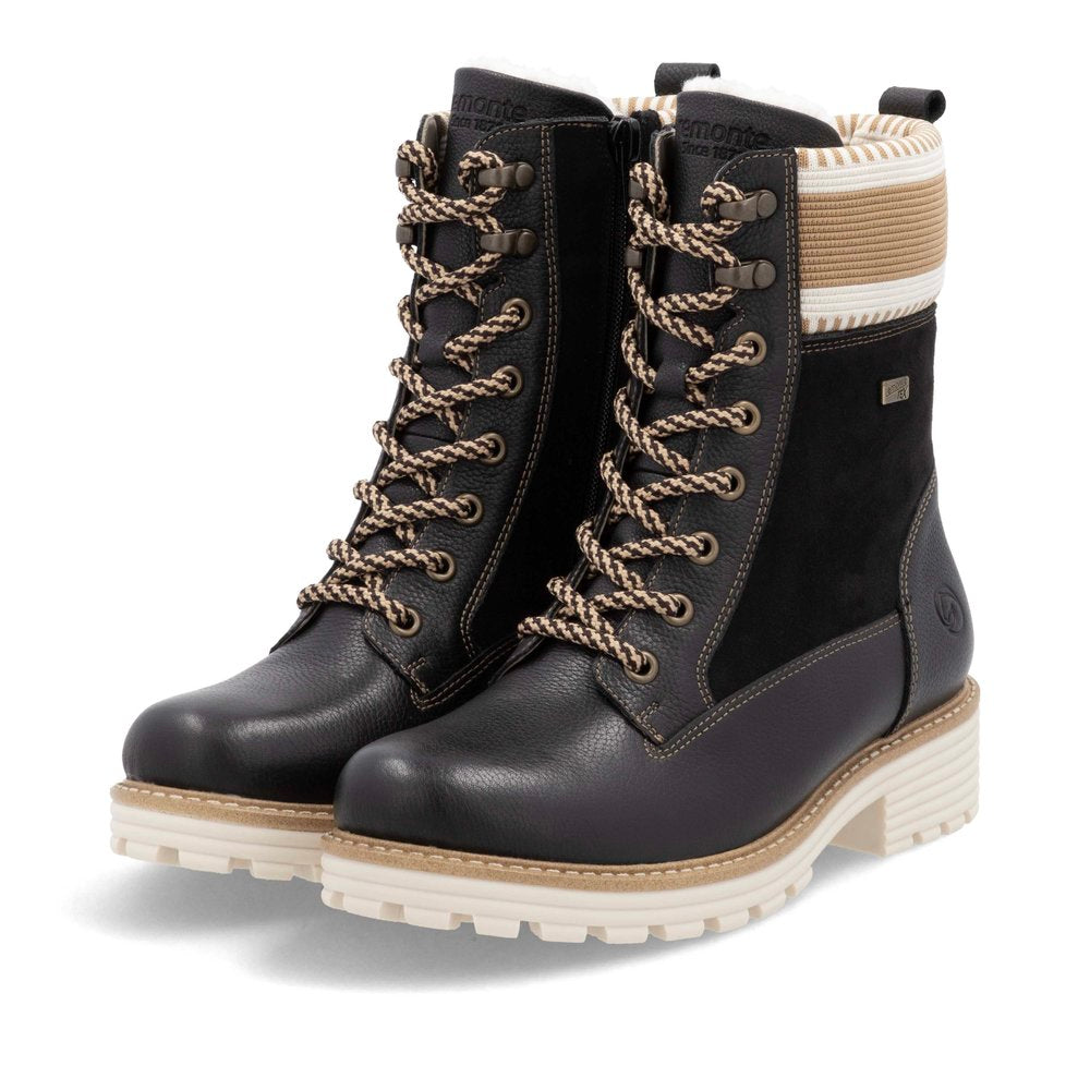 Black lace-up boots with off-white tread.