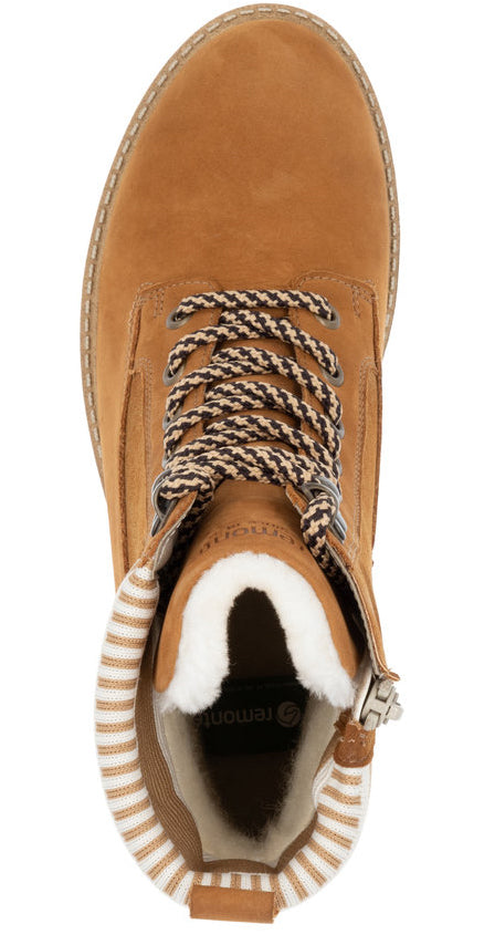 Top-down view of brown ankle boot with decorative laces and white fur lining.