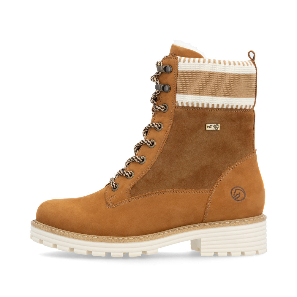 Tan-colored lace-up boot with suede details and a striped knit upper portion.