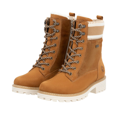 Pair of light brown combat boots with lug soles and knit trim.