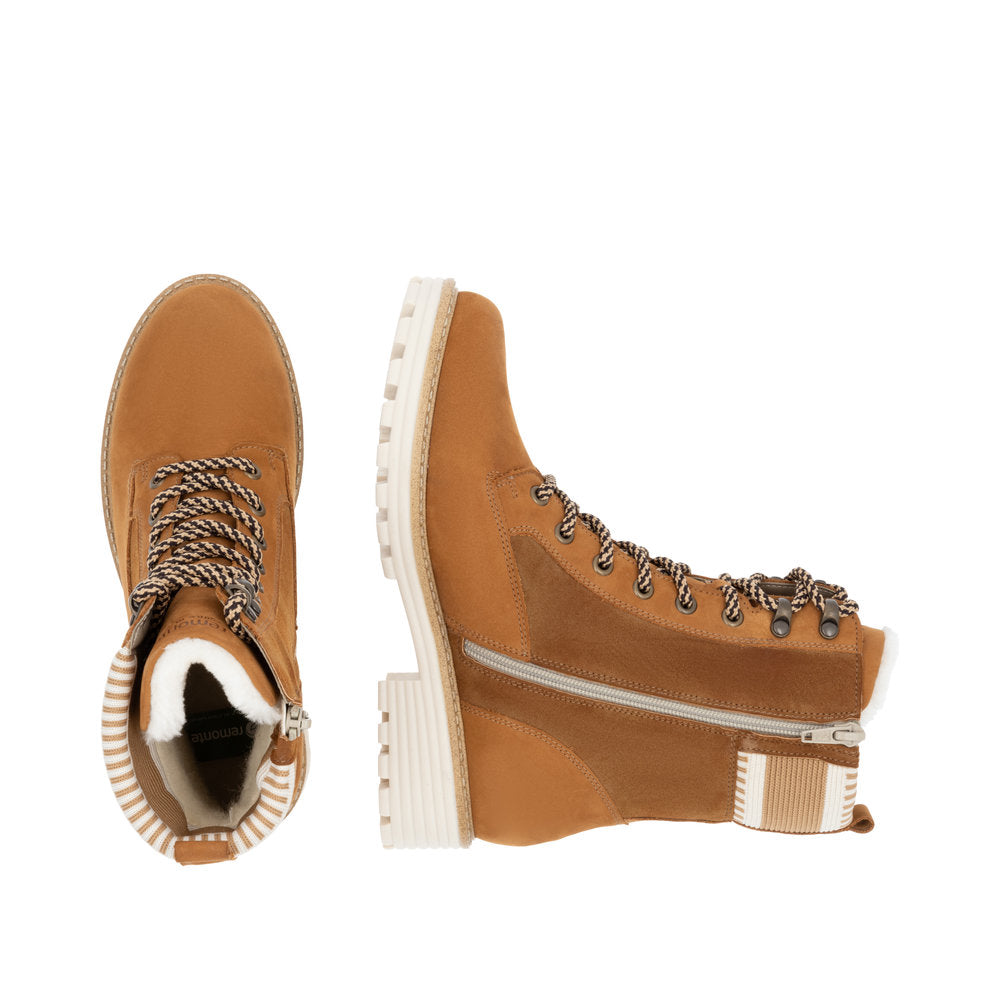 Tan lace-up ankle boots with faux fur collar and side zipper.