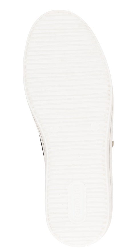 Close-up of a white shoe sole with horizontal grooves.