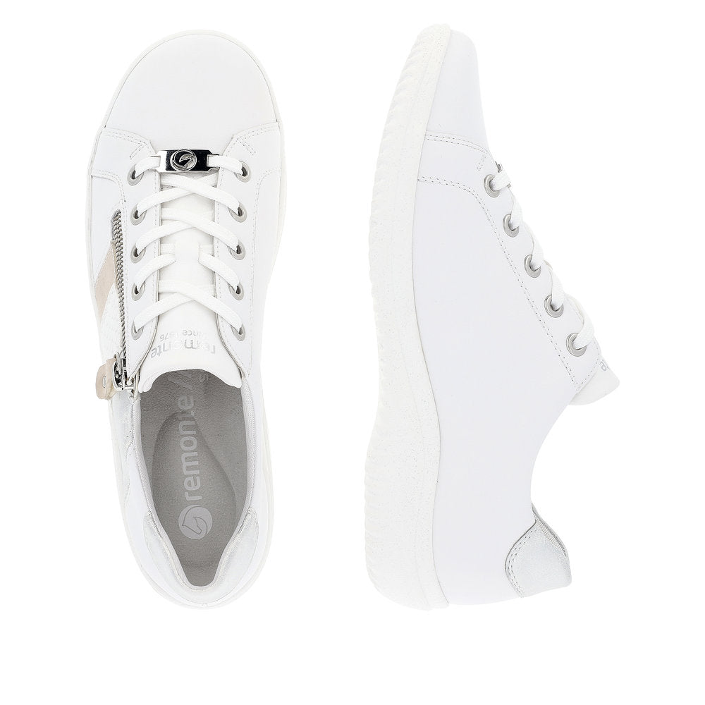 Pair of white leather sneakers with silver accents, lace-up closure, and a side zipper.