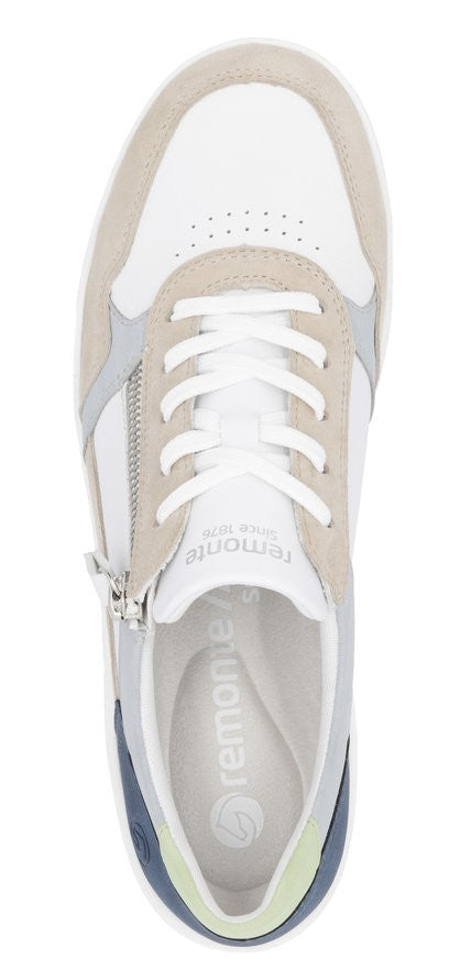 A top down view of a white sneaker with white laces and a zipper on the side.