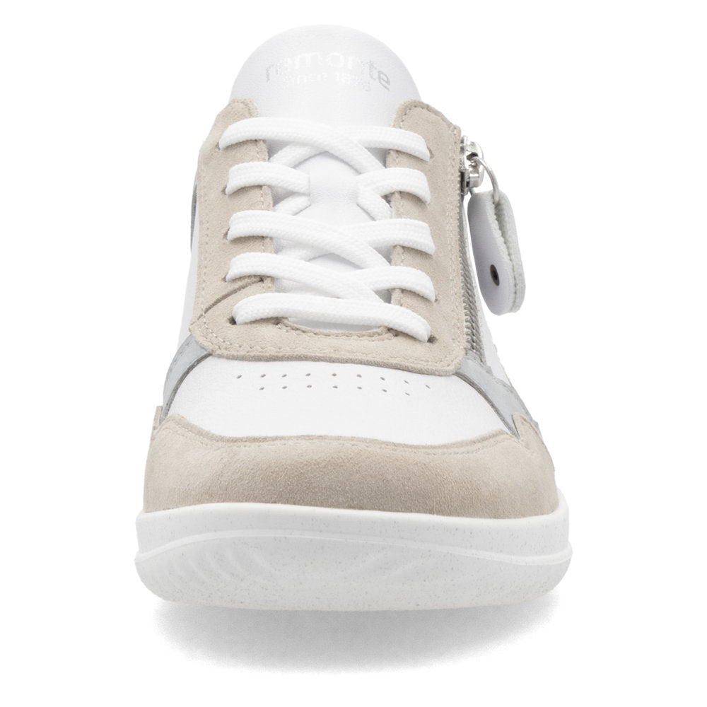 Front view of a white leather tennis shoe with tan suede accents, white laces, and a silver zipper.