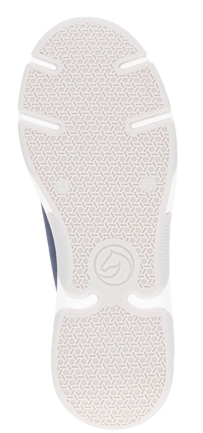 Close-up of a shoe sole featuring a white textured grip pattern.