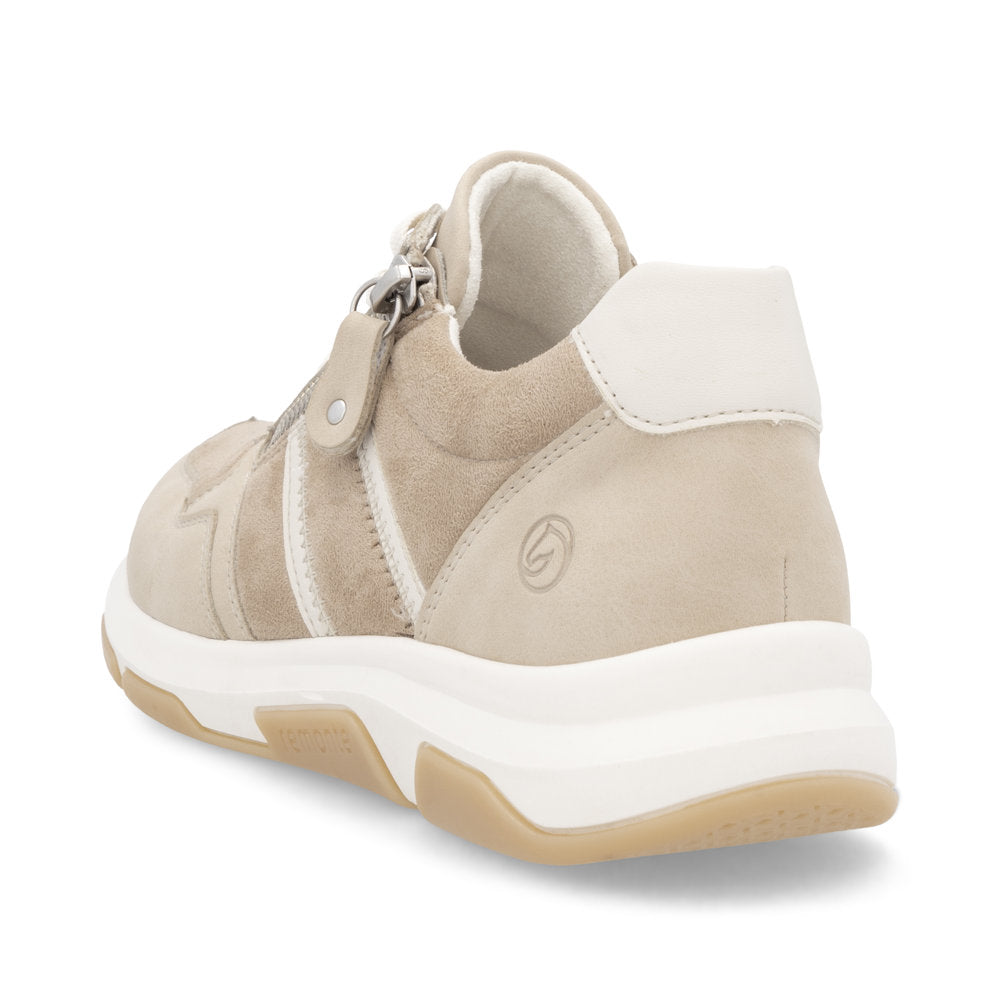 Beige sneaker with white accents and thick white sole, featuring a side zipper.