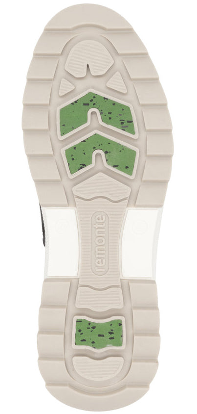 The outsole of a shoe features beige treads with green accents and the word 'remonte' in the center.