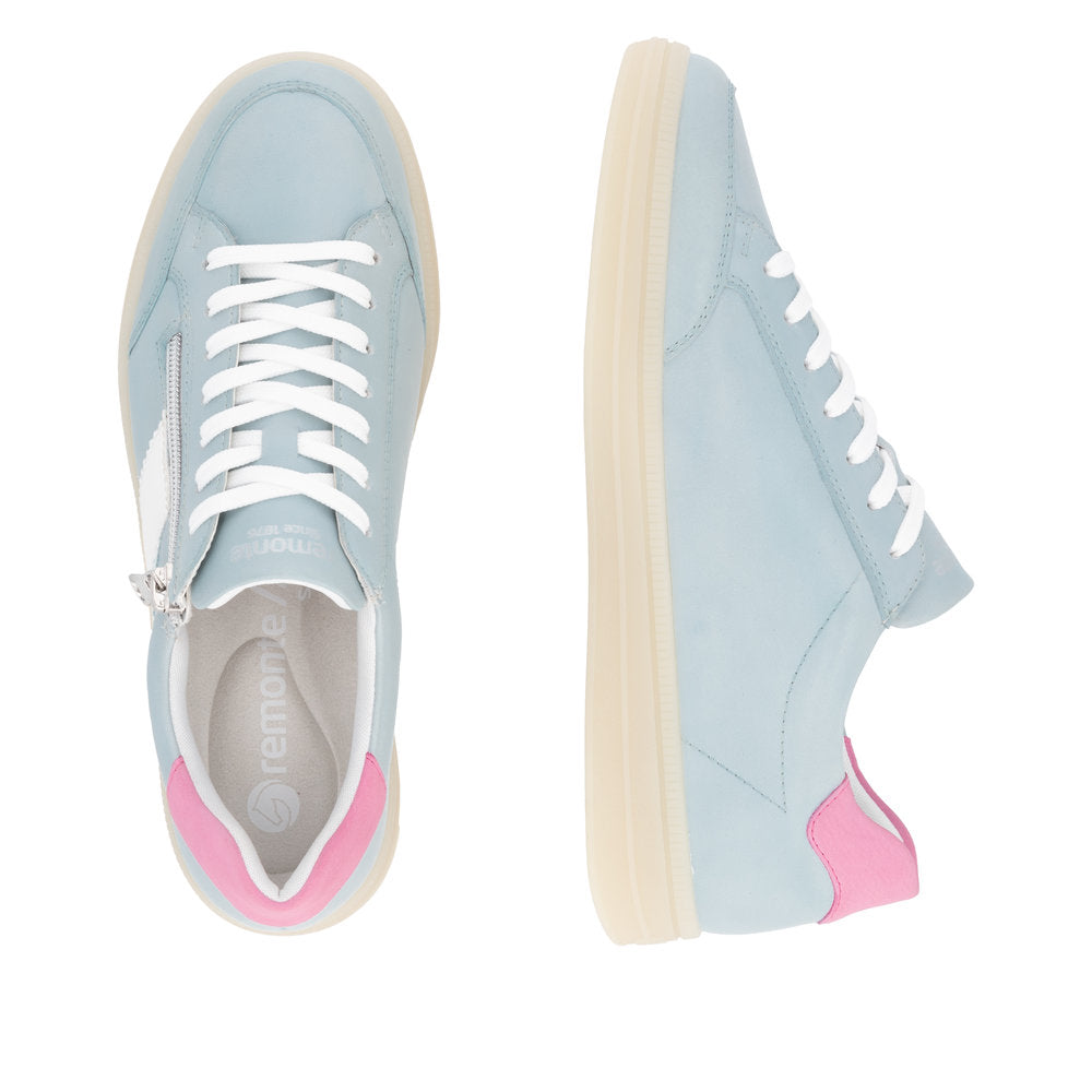 Two Remonte low-top sneakers, in light blue, with white laces and a white side accent, each having a pink heel accent and a white midsole.