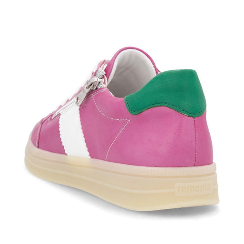 A pink leather sneaker with a white stripe, green heel, and light beige sole.